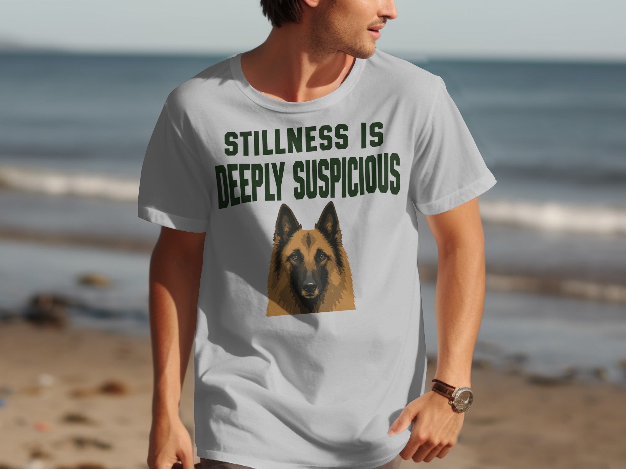 T-shirt with German Shepherd portrait and "Stillness is deeply suspicious" text.