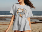 White t-shirt with a heart-shaped collage of dogs and the word "DOGAHOLIC".