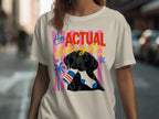 Black Labrador with a sock in its mouth, on a shirt with colorful stripes and stars.