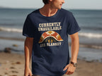 Dark blue t-shirt with "CURRENTLY UNAVAILABLE SEE BLANKET" text and dog graphic.
