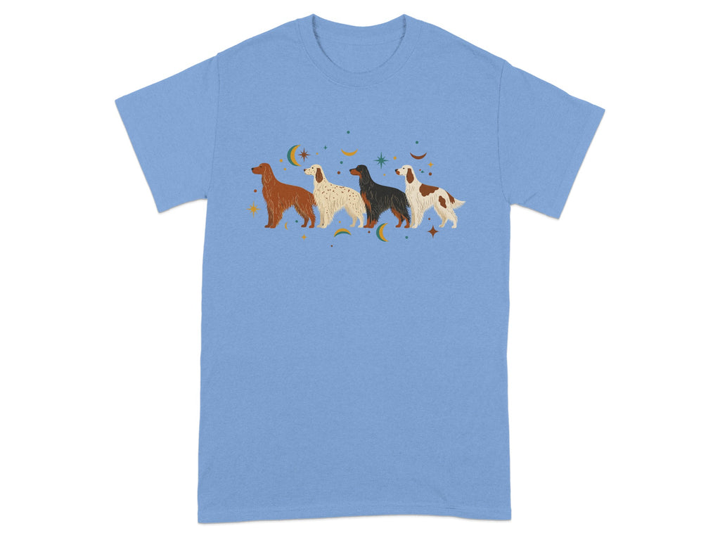 Light blue t-shirt with four stylized dogs and celestial motifs.