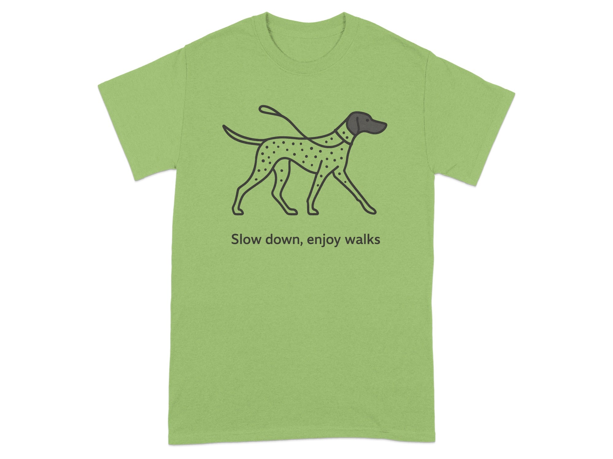 Light green t-shirt with a dalmatian illustration and text "Slow down, enjoy walks".