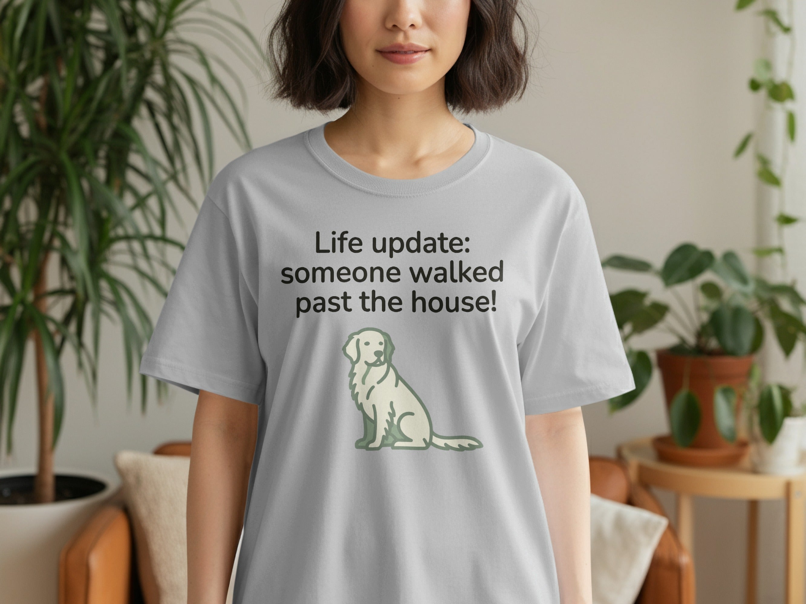 Gray t-shirt with "Life Update: someone walked past the house!" text and dog graphic.