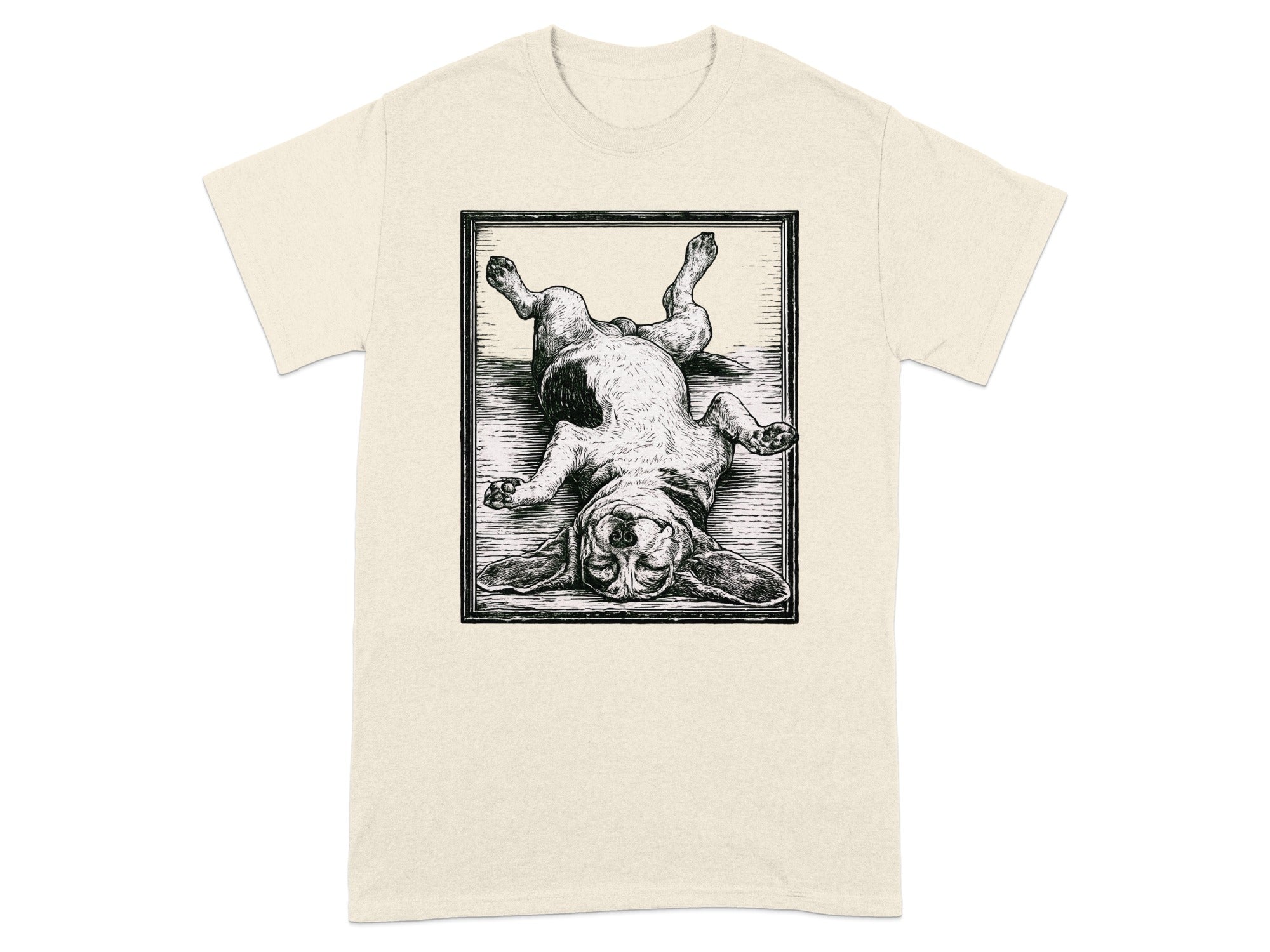 Beige t-shirt with a framed black and white sketch of a basset hound lying on its back.