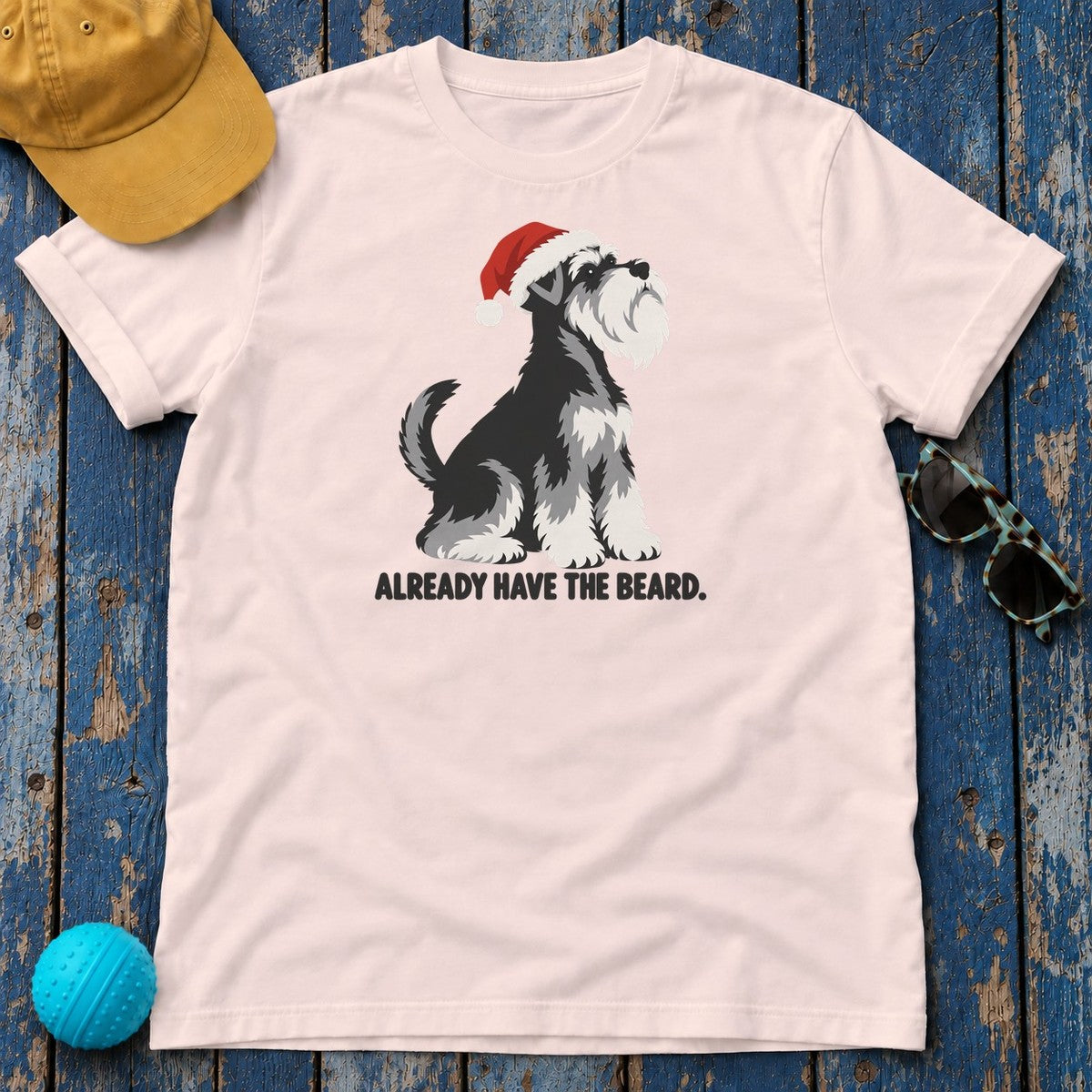 Already Have the Beard Sitting Santa Schnauzer T-Shirt in Soft Pink - flat lay