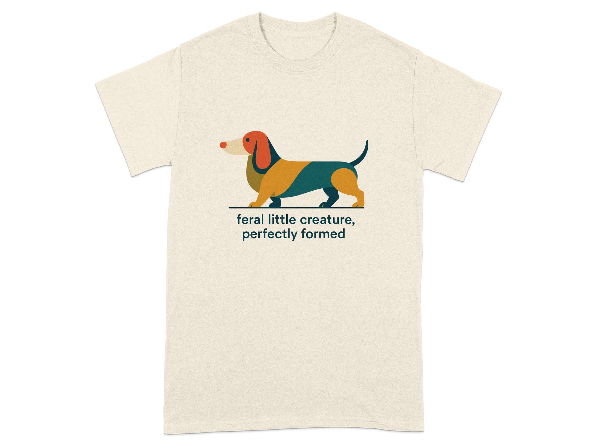 T-shirt with a colorful dachshund illustration and the text "feral little creature, perfectly formed".