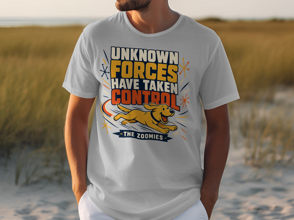 White t-shirt with text "UNKNOWN FORCES HAVE TAKEN CONTROL THE ZOOMIES" and a running dog.