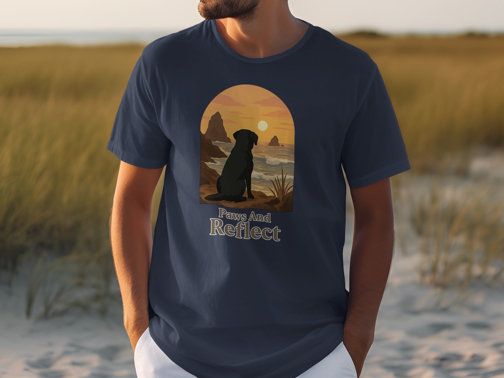 Dark Labrador silhouette looking at ocean sunset with text "Paws And Reflect".