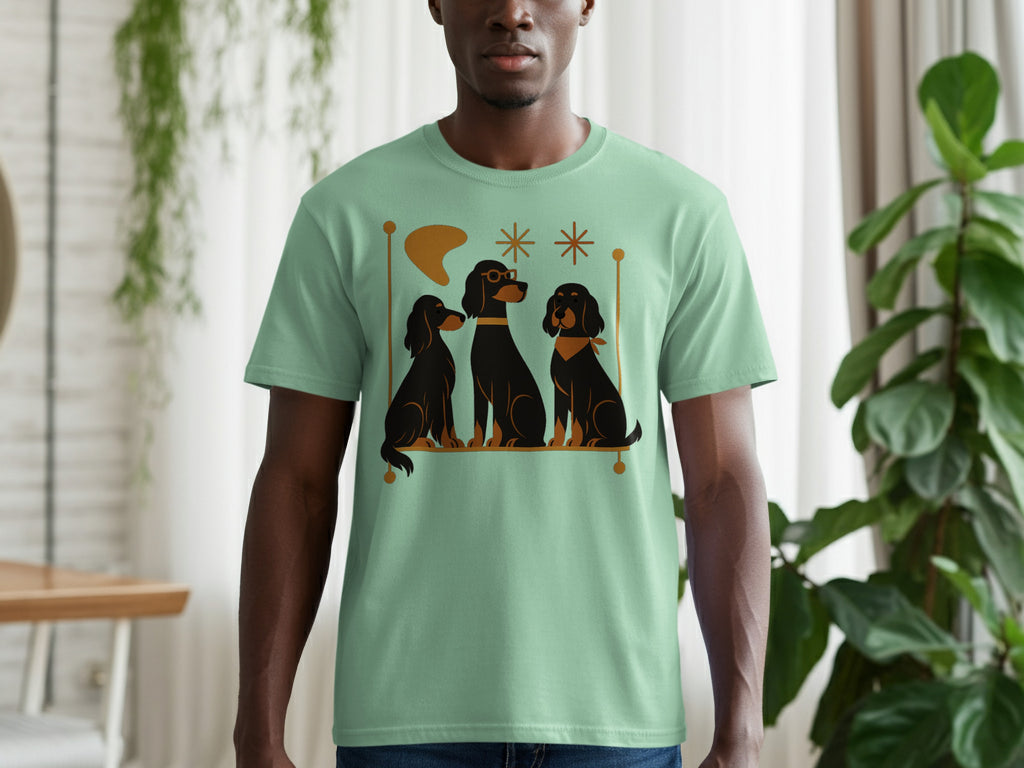 Mint green t-shirt with a stylized graphic of three black dogs and geometric shapes.