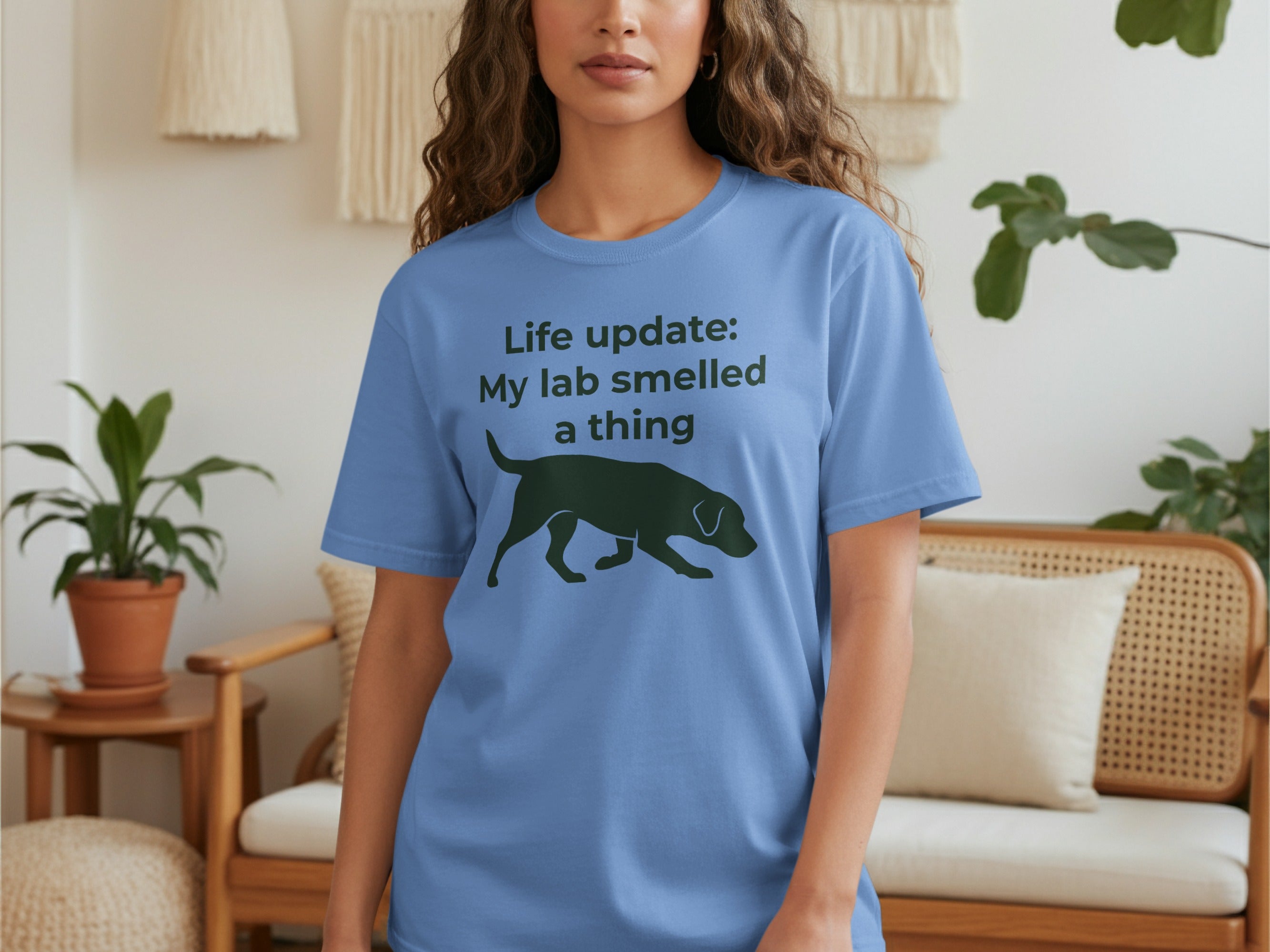 Blue t-shirt with black text "Life update: My lab smelled a thing" and silhouette.
