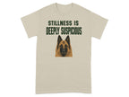 Tan t-shirt with "STILLNESS IS DEEPLY SUSPICIOUS" and a dog's head.