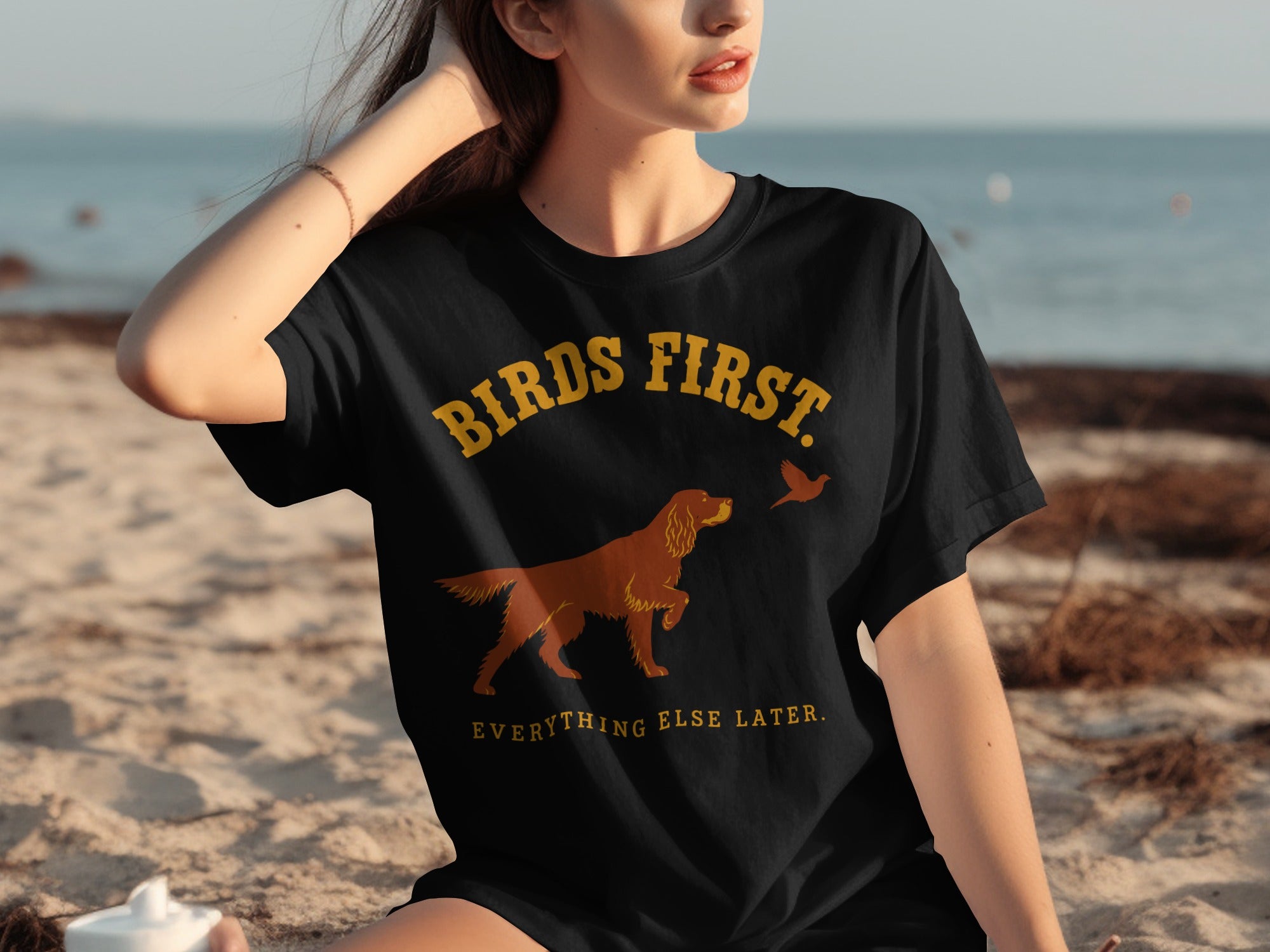 Black t-shirt with "BIRDS FIRST. EVERYTHING ELSE LATER." and dog/bird graphic.