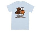 Light blue t-shirt with a cartoon brown Labrador and coffee cup, reads "Powered by Chocolate Labrador & Coffee".
