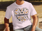 White t-shirt with a heart of corgi dogs and paw prints.