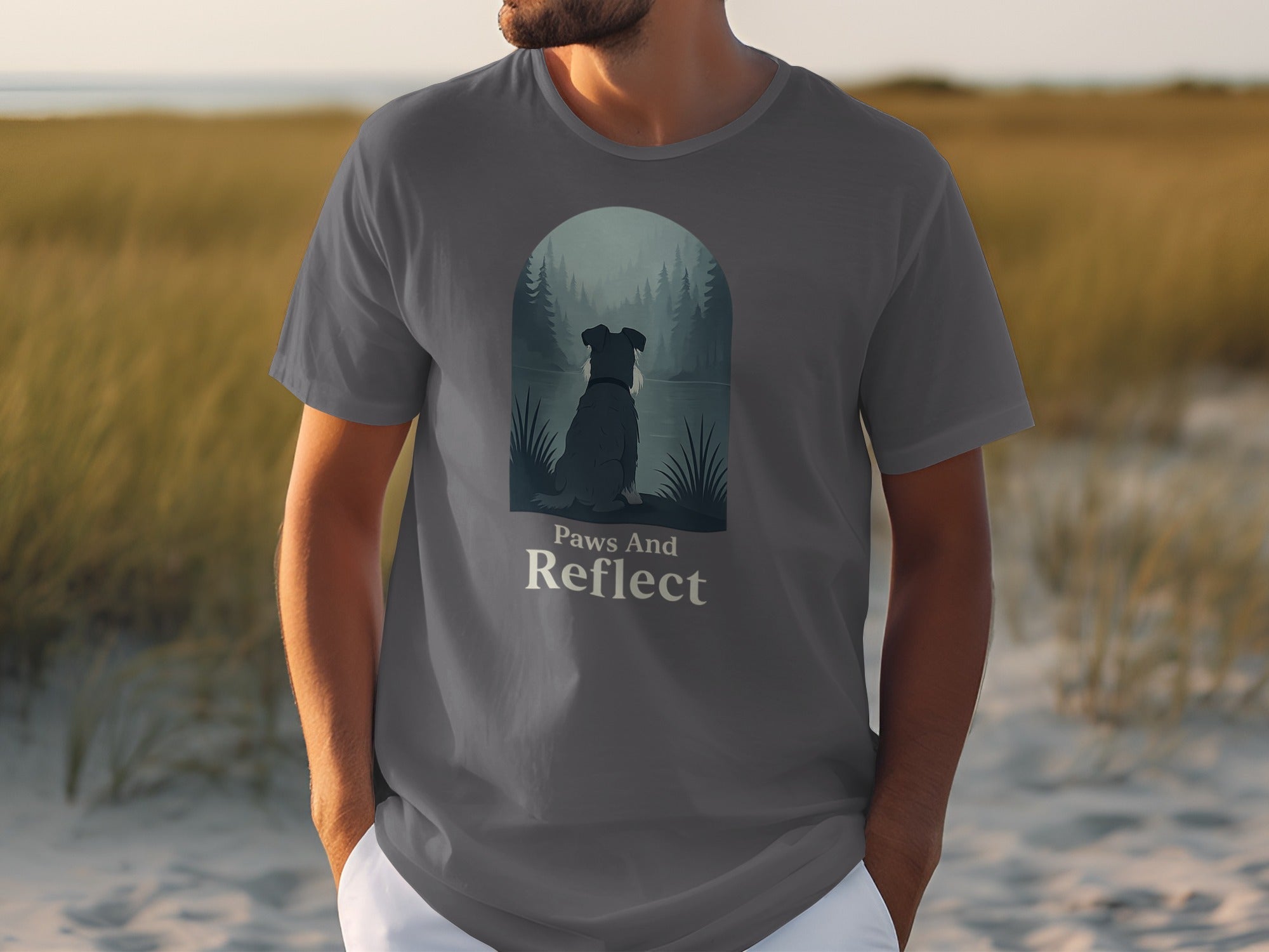 T-shirt with dog gazing at forest lake, text "Paws And Reflect".