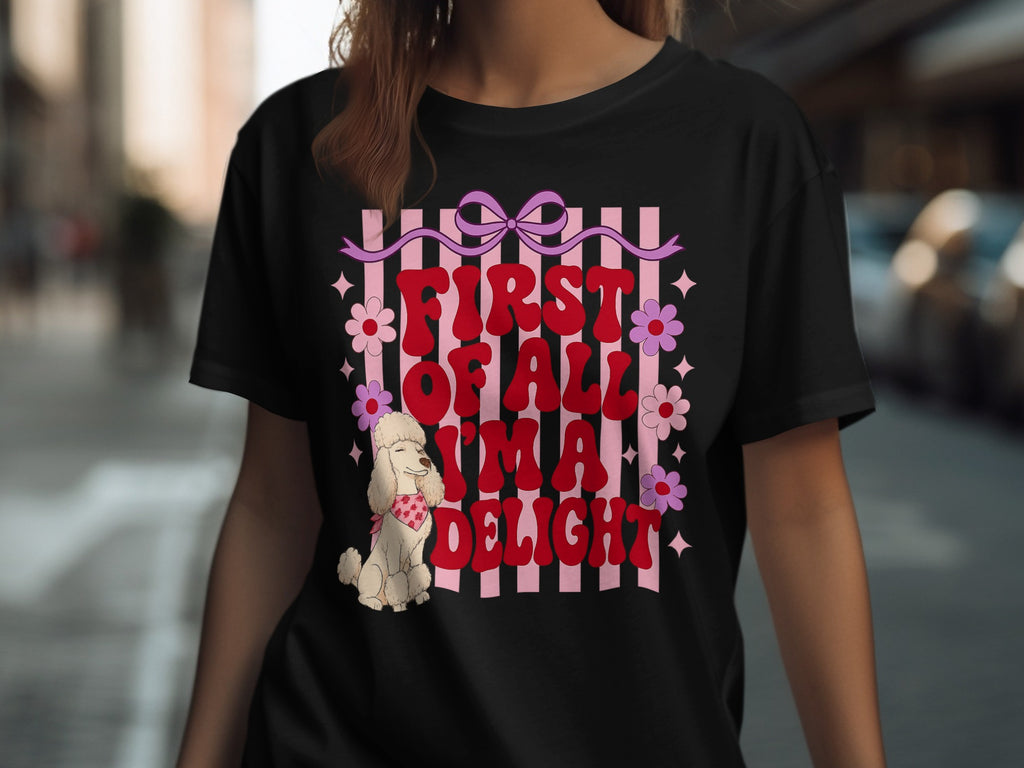 Black t-shirt with "First of all, I'm a total delight" text, pink bow, and flowers.
