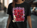 Black t-shirt with "First of all, I'm a total delight" text, pink bow, and flowers.