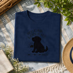 My chocolate lab loves me tee on a navy shirt, folded flat lay