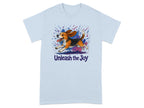 Light blue t-shirt with a cartoon beagle running through colorful paint splashes and the text "Unleash the Joy".