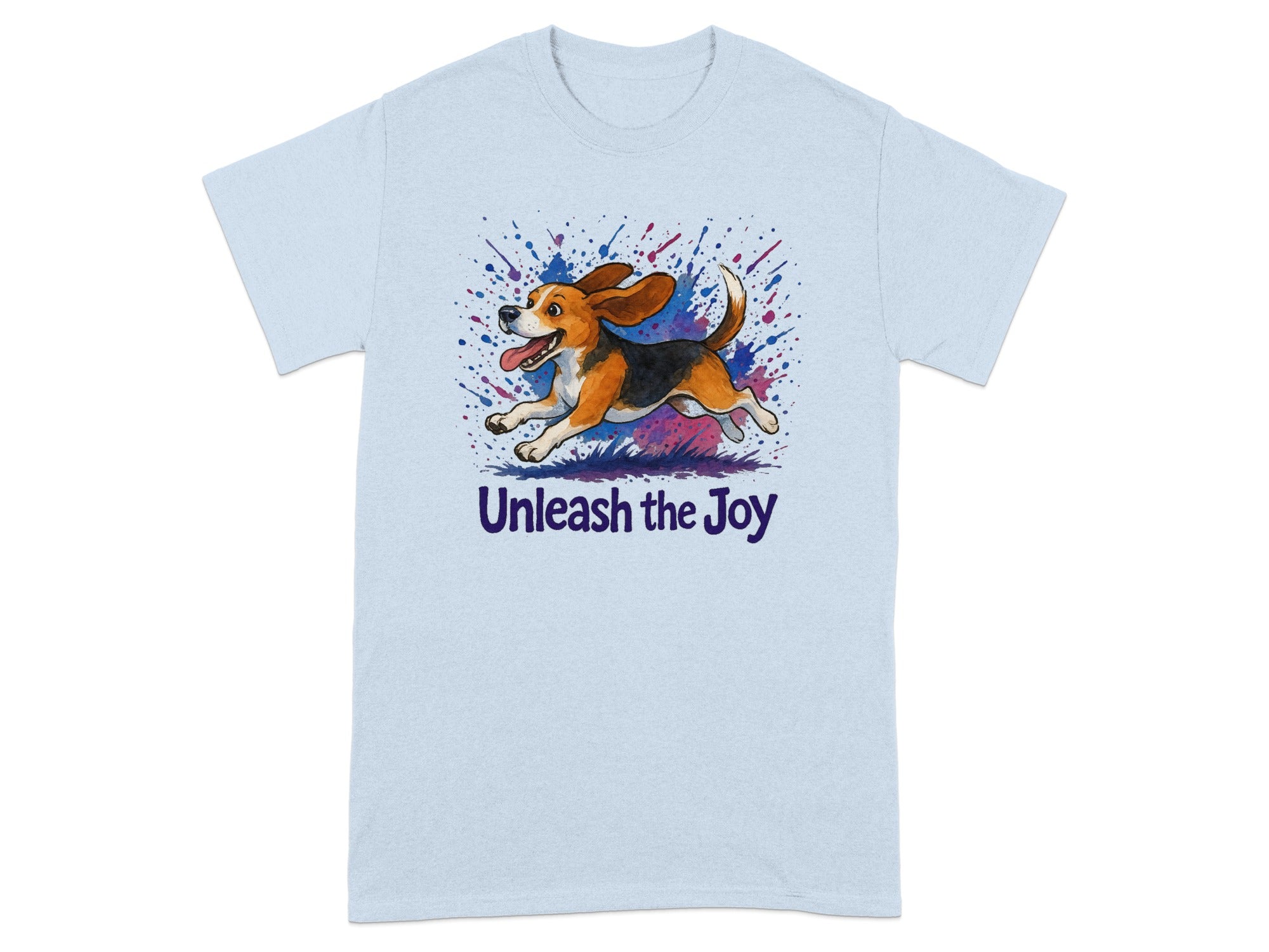 Light blue t-shirt with a cartoon beagle running through colorful paint splashes and the text "Unleash the Joy".