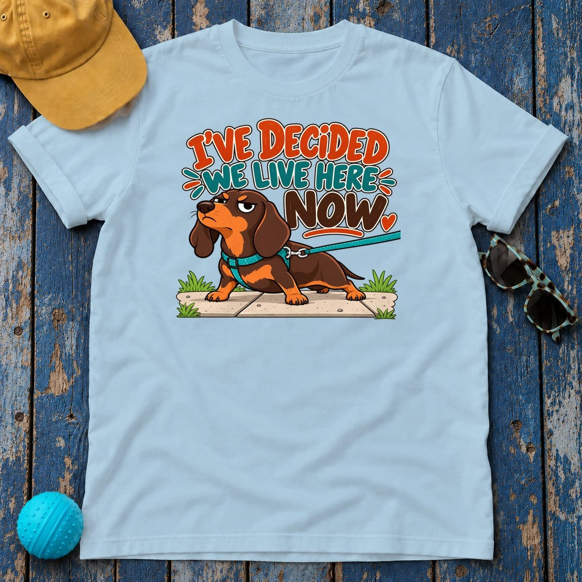 I've Decided We Live Here Now Dachshund T-Shirt in Light Blue - flat lay