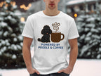 White t-shirt with a poodle and coffee cup graphic, text "POWERED BY POODLE & COFFEE".
