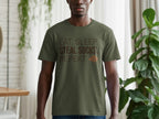 Olive t-shirt with "EAT. SLEEP. STEAL SOCKS. REPEAT." text and a small dog graphic.