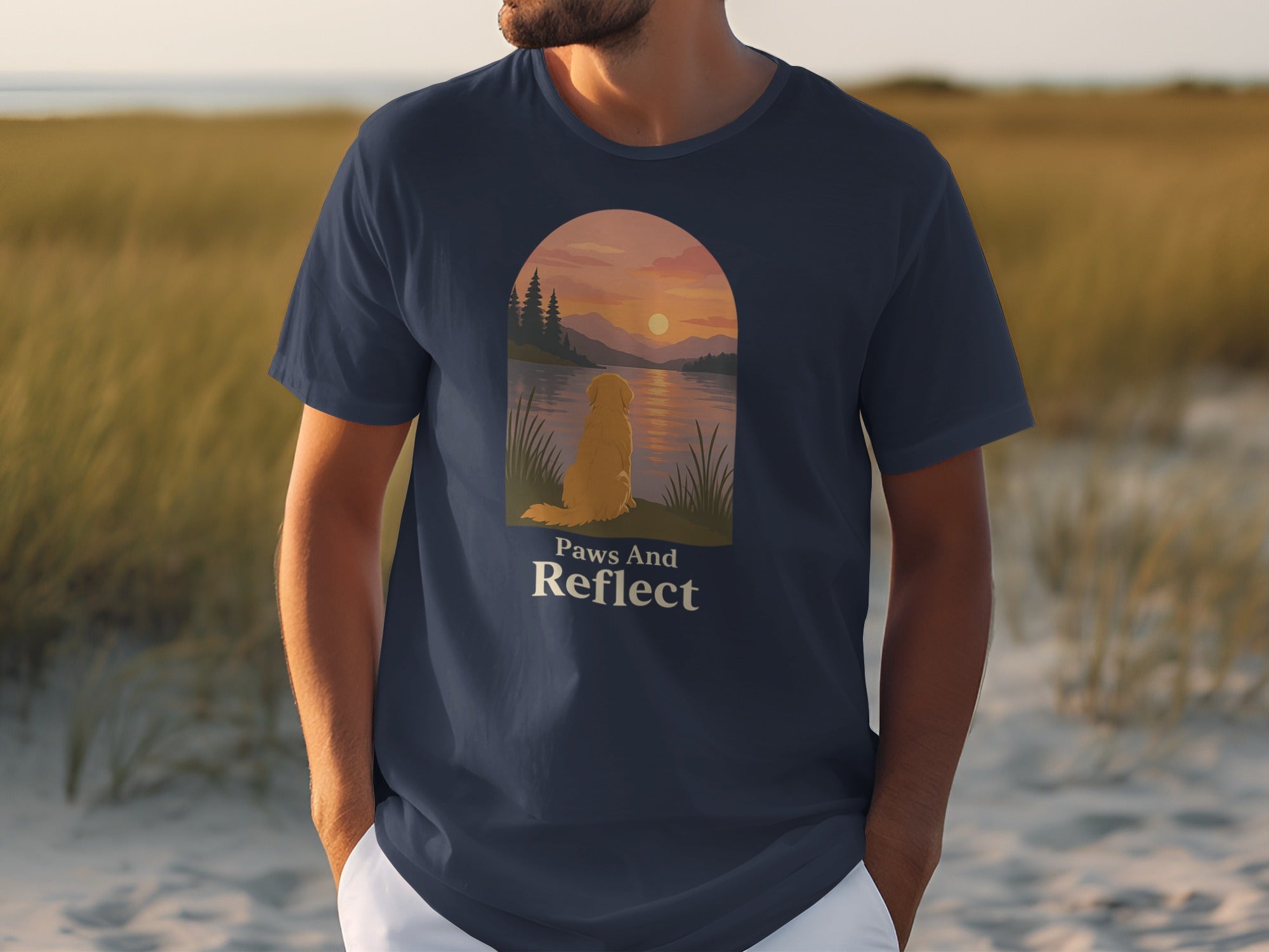 Dark blue t-shirt with a golden retriever sitting by a lake at sunset.