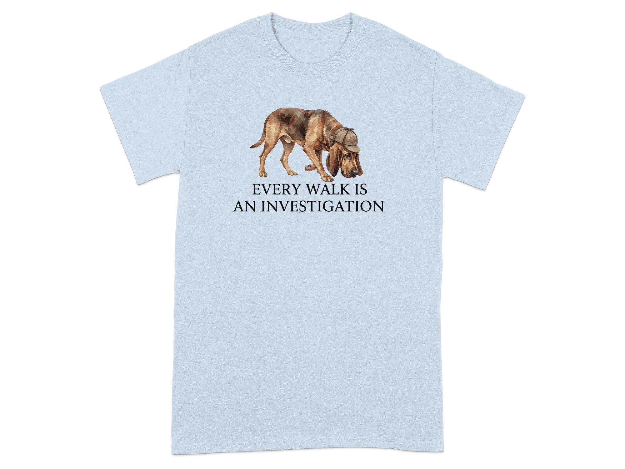 Light blue t-shirt with watercolor dog wearing a hat and the text "EVERY WALK IS AN INVESTIGATION".