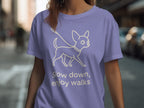 Lavender t-shirt with illustration of a chihuahua and text "Slow down, enjoy walks."