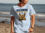 Light blue t-shirt with German Shepherd graphic and "OVERTHINKING ON EVERYONE'S BEHALF" text.
