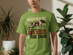 Green t-shirt with dog running graphic and "Powered by Bird Scent & Pure Chaos" text.