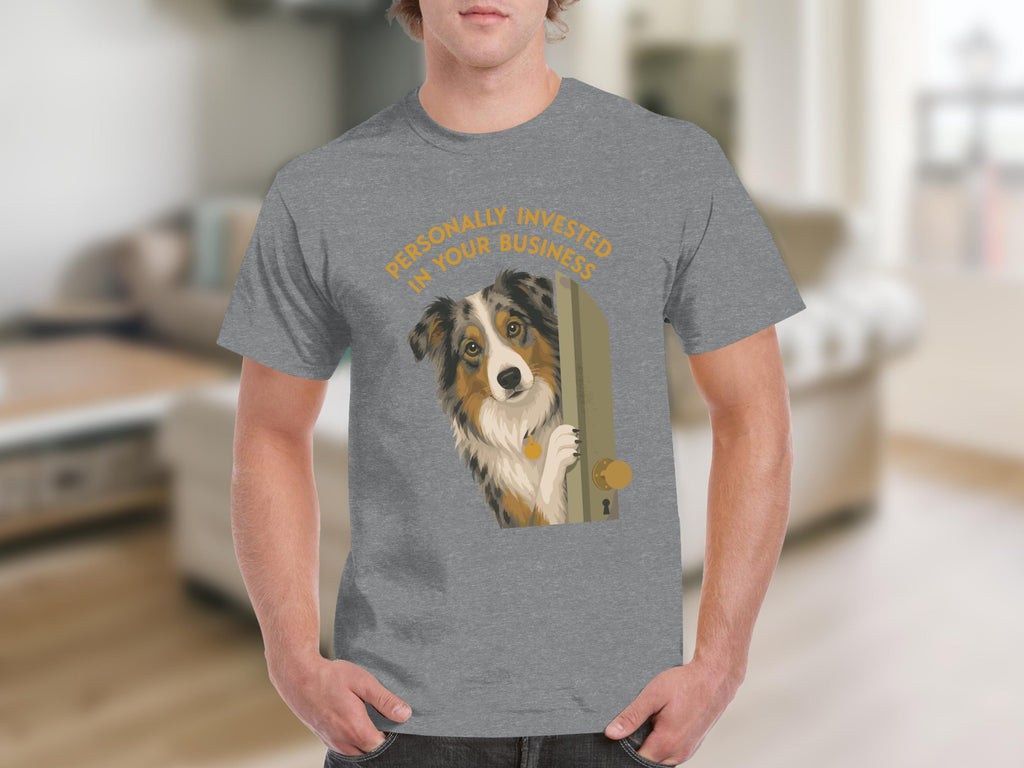 Man wearing gray t-shirt with dog peeking around doorway design.