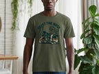 Green t-shirt with a graphic of a dog sniffing the ground and the text "TRUST THE NOSE".