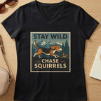 Black v-neck t-shirt with "STAY WILD CHASE SQUIRRELS" text and dog chasing squirrel graphic.
