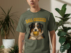 Man wearing green t-shirt with dog and "BALL OBSESSED" text.