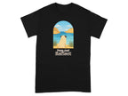 Black t-shirt with pug facing serene water landscape and text "Paws And Reflect."