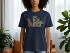Navy t-shirt with dog silhouette and text "EAT. SLEEP. ZOOMIES. REPEAT."