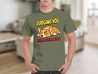 Olive t-shirt with "Judging You From Floor Level" text and sleeping corgi graphic.
