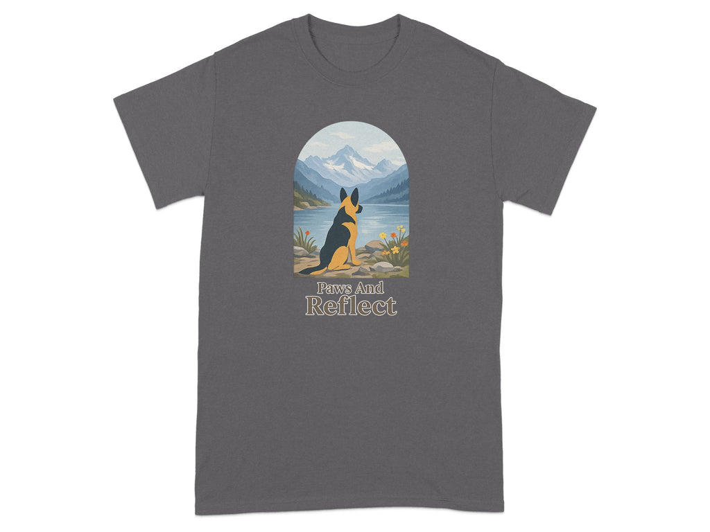 German Shepherd gazes at mountains reflected in lake; "Paws And Reflect" text.