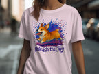 Pink t-shirt with a running corgi and text "Unleash the Joy."