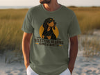 Olive green t-shirt with a dog graphic and "Selective Hearing Since Birth" text.