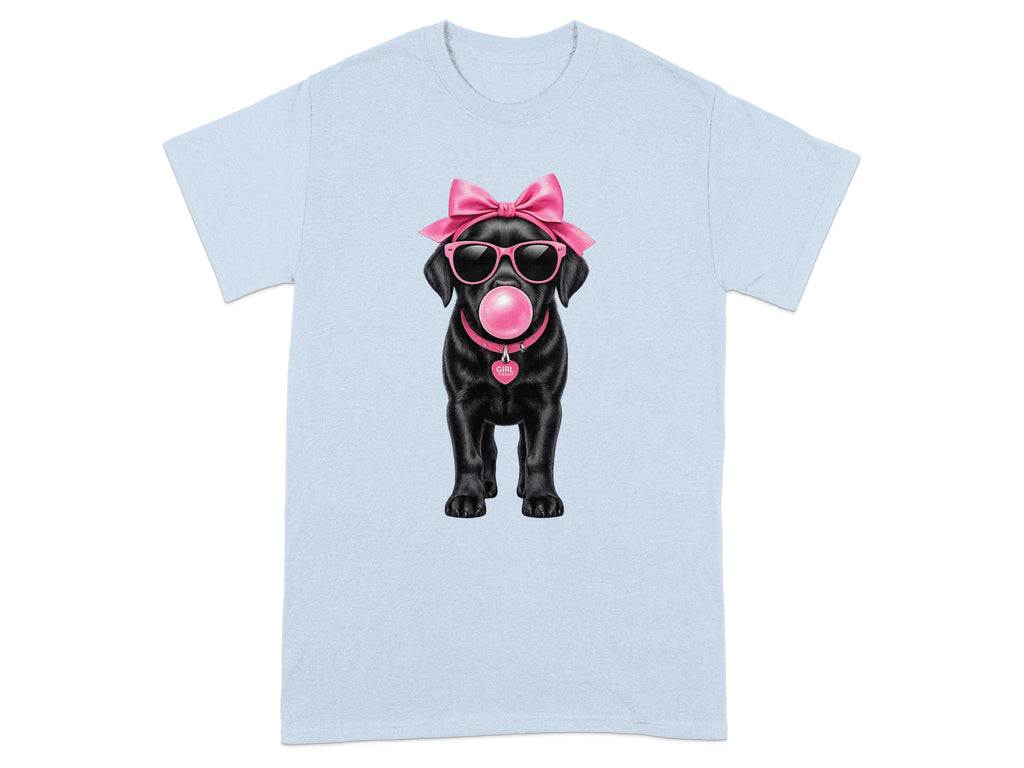Black Labrador puppy with pink bow, sunglasses, and bubblegum on a light blue t-shirt.