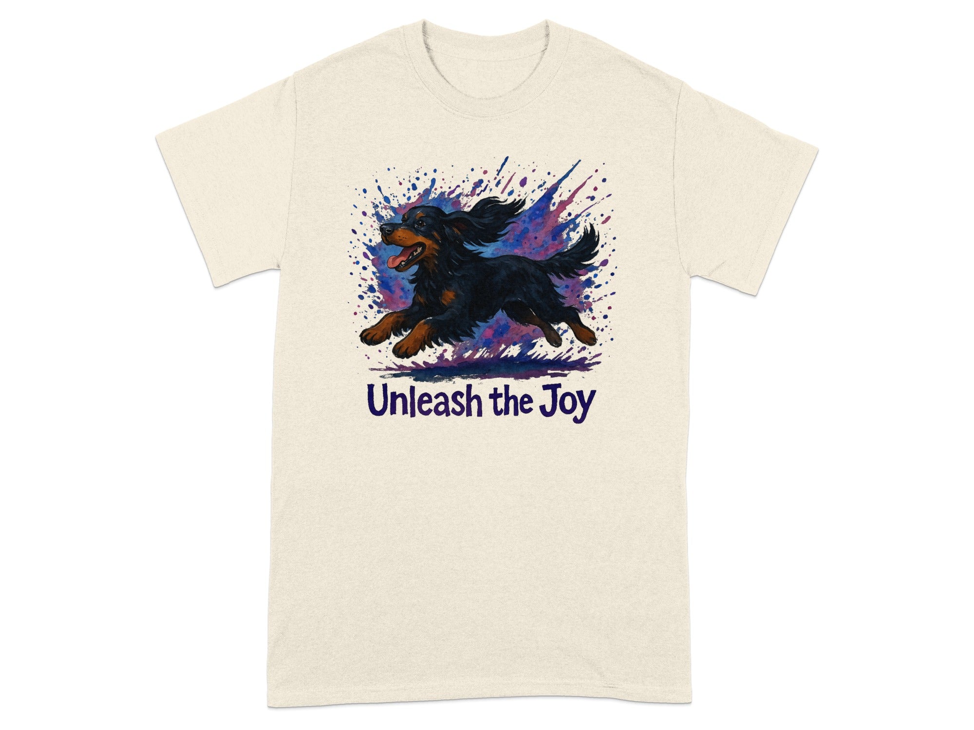 T-shirt with a black and tan dog running through a watercolor paint splash and the text "Unleash the Joy."