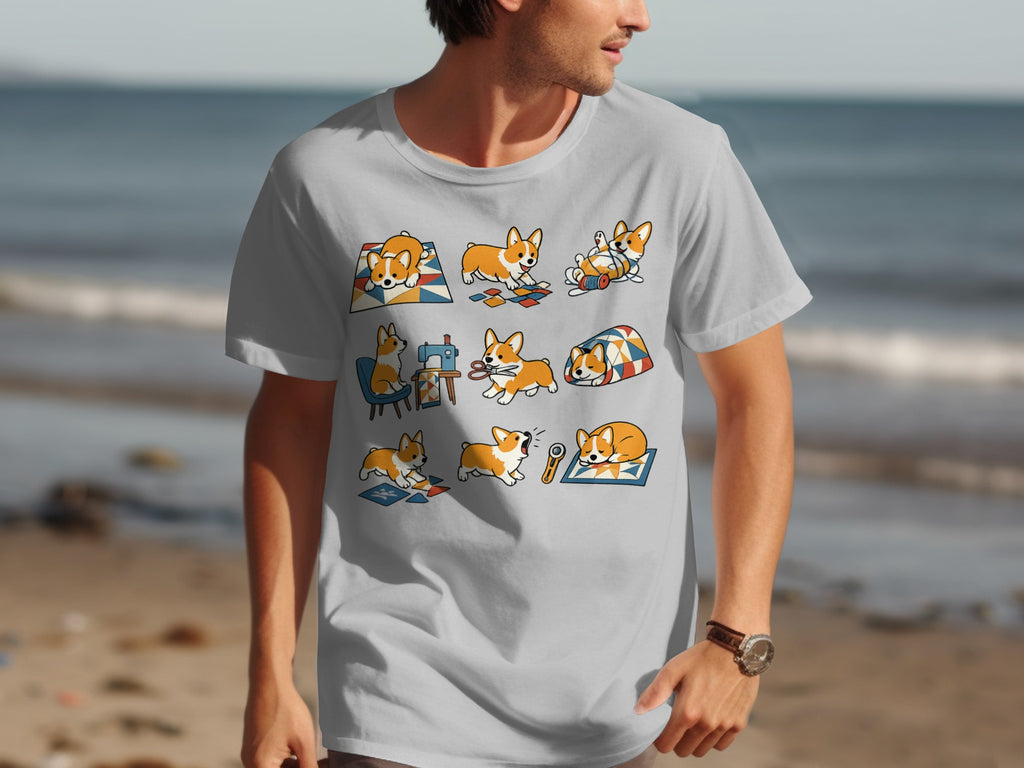 A light grey t-shirt with a graphic of nine cute corgis doing various activities in colorful blocks.