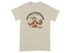 Beige t-shirt with Bracco Italiano dog detective illustration.