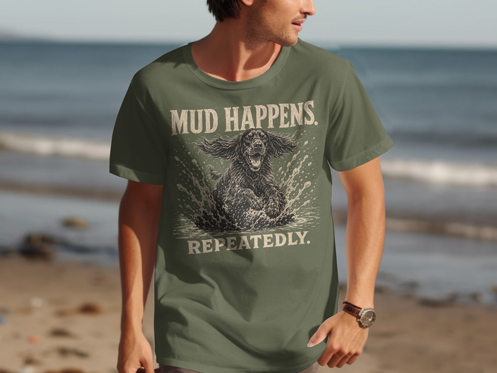 Green t-shirt with "MUD HAPPENS REPEATEDLY" text and dog splashing in water graphic.