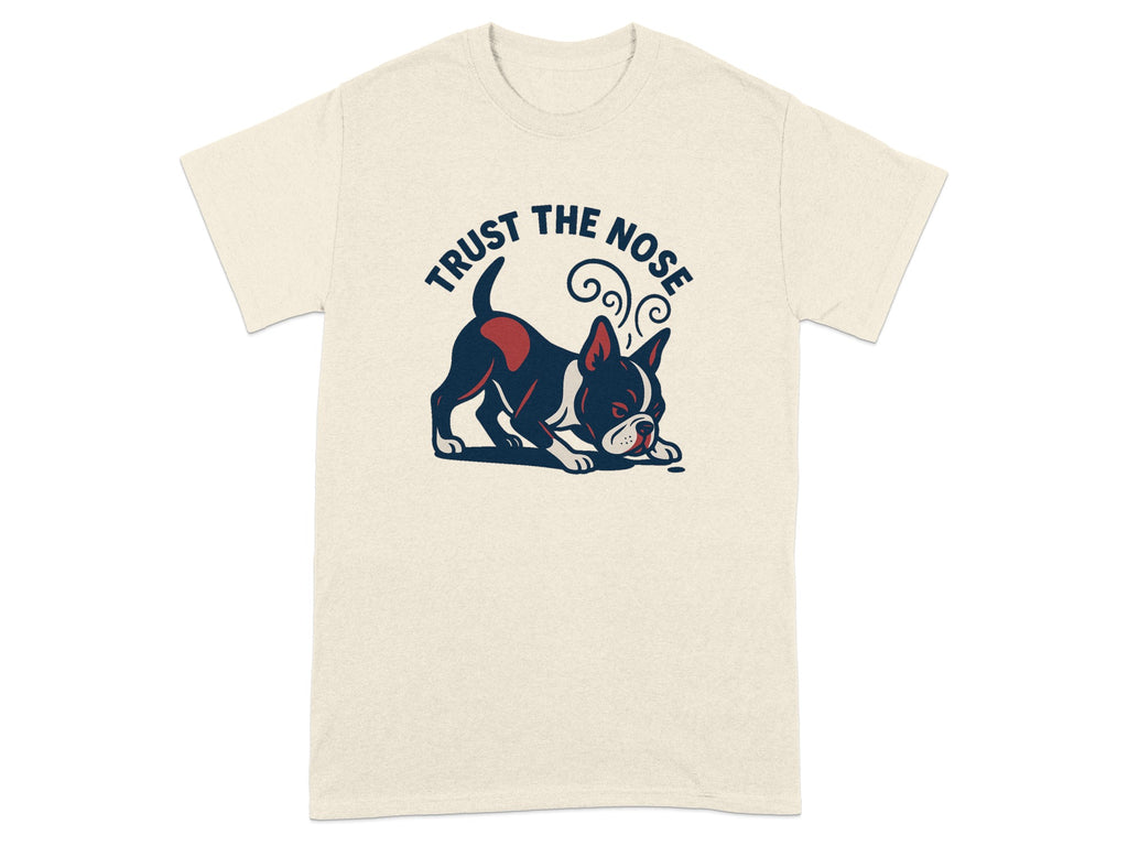 Boston terrier illustration with text "TRUST THE NOSE" on a cream t-shirt.