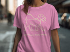 Pink t-shirt with line art of a dog and text "Slow down, enjoy walks."