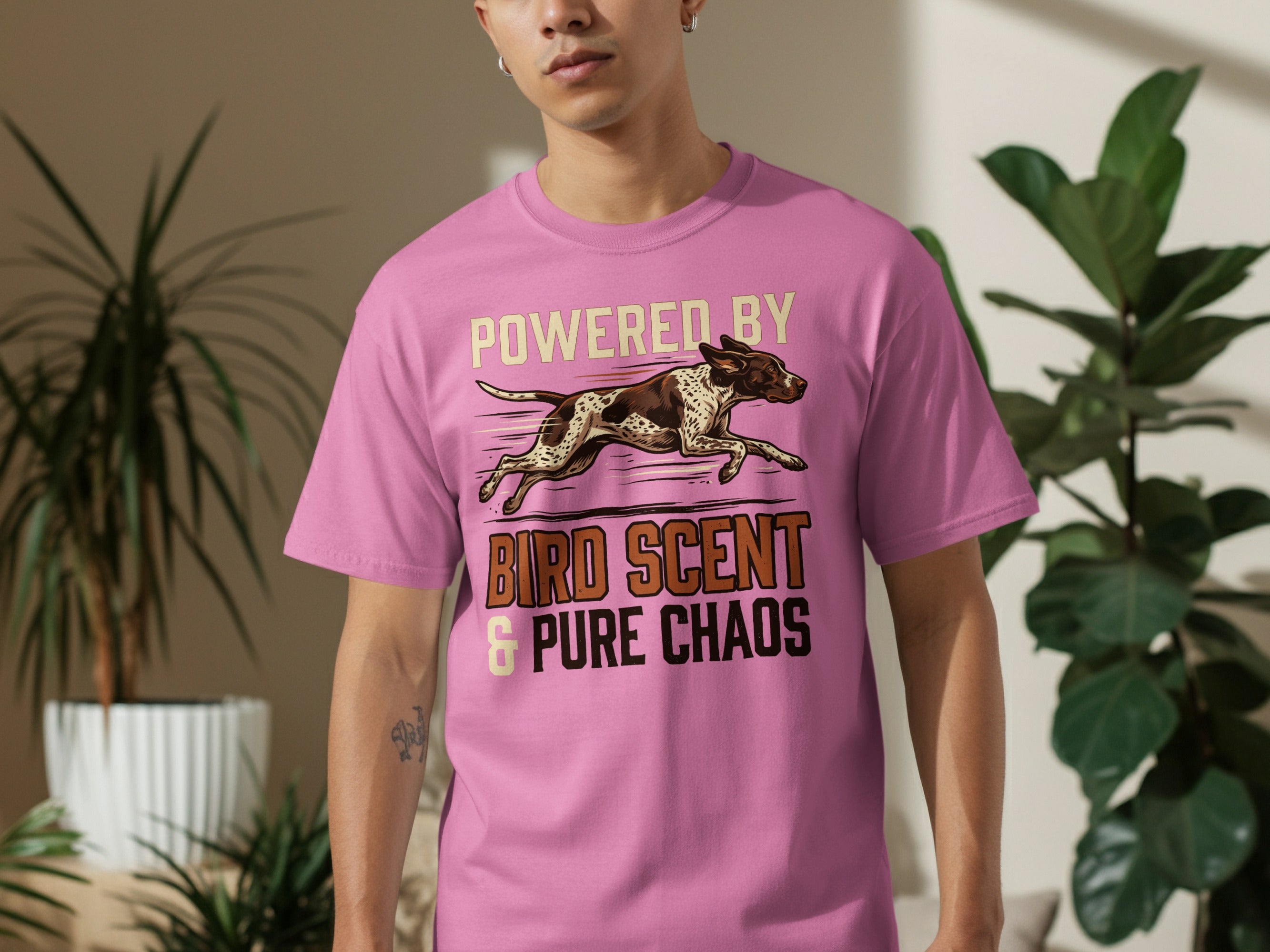 Pink t-shirt with "Powered by Bird Scent & Pure Chaos" and a dog running.